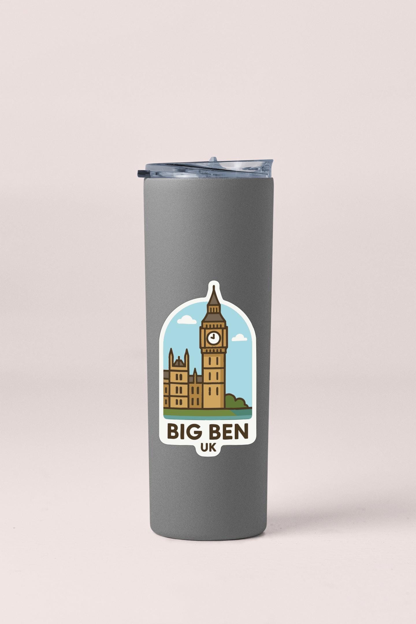 A gray tumbler with a sticker depicting Big Ben and the UK.
