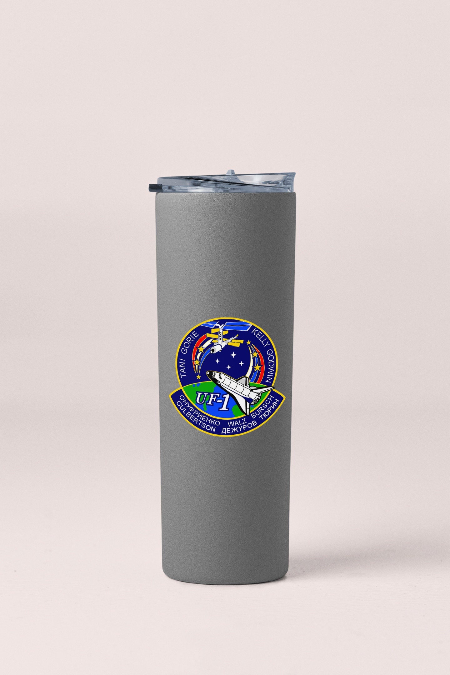 a stainless steel tumbler with a nasa emblem on it