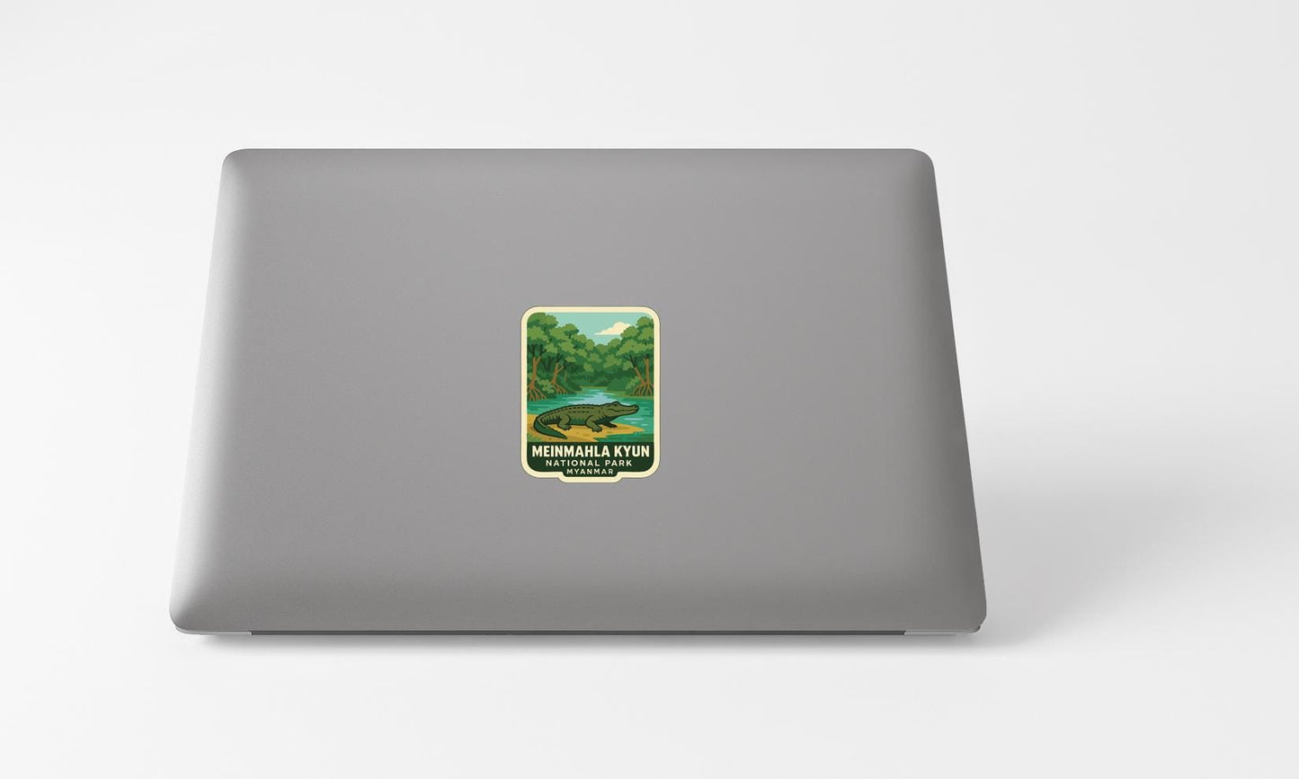 A sticker with a landscape image on a laptop.