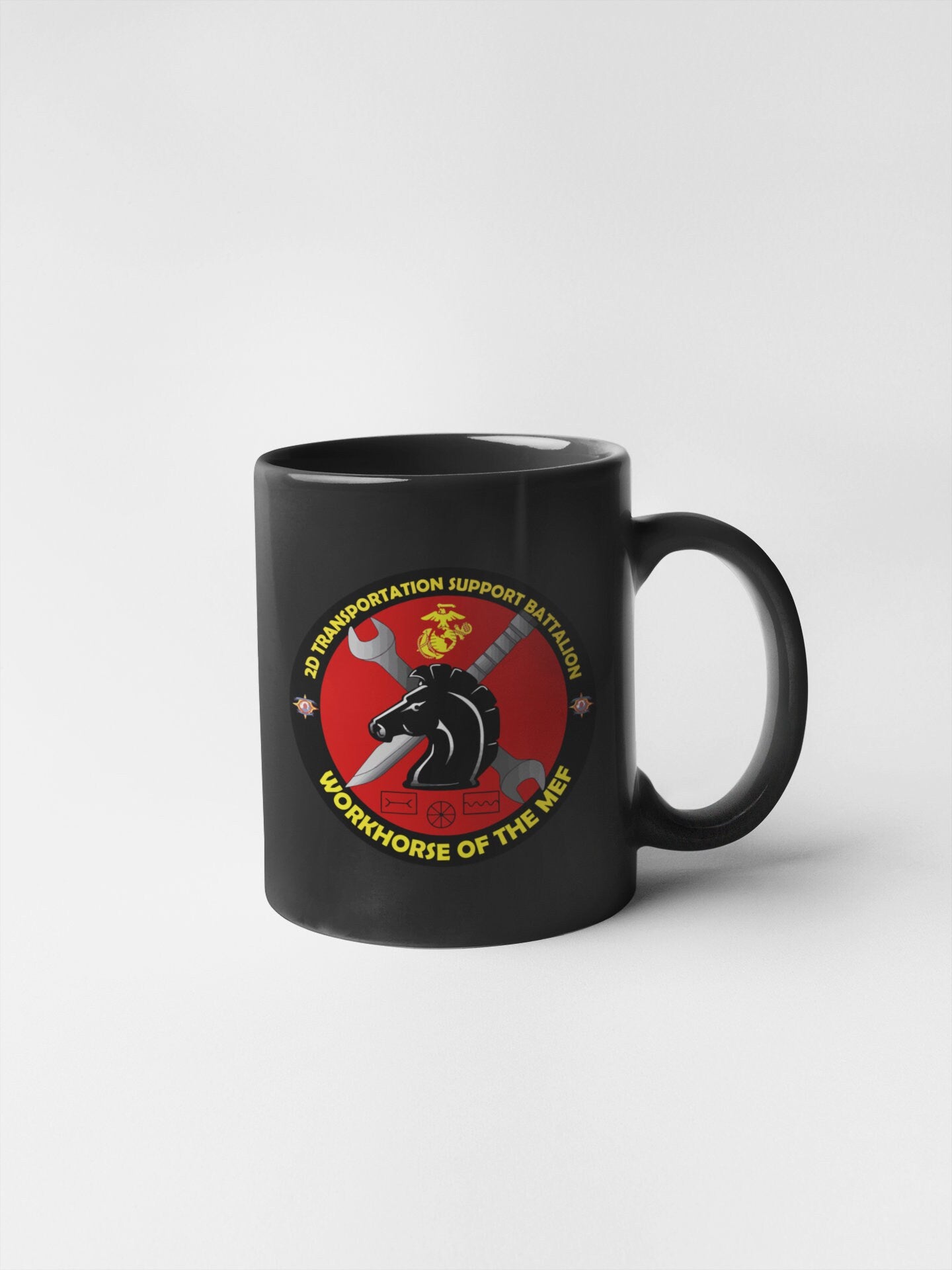 a black coffee mug with a mouse on it