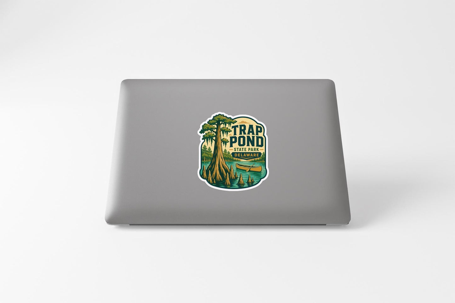 A sticker on the back of a laptop that says "Trap Pond State Park".
