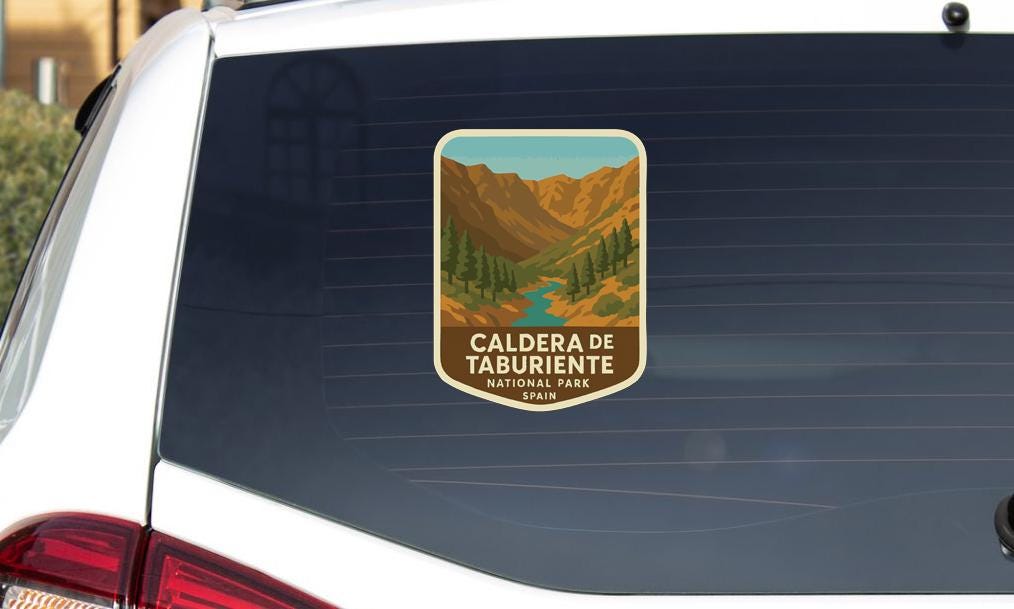 A sticker on the rear window of a car that says "CALDERA DE TABURIENTE NATIONAL PARK, SPAIN".
