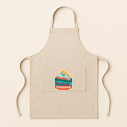 A beige apricot with a small logo on the front pocket, featuring a mountain landscape and the word "Pokhara".