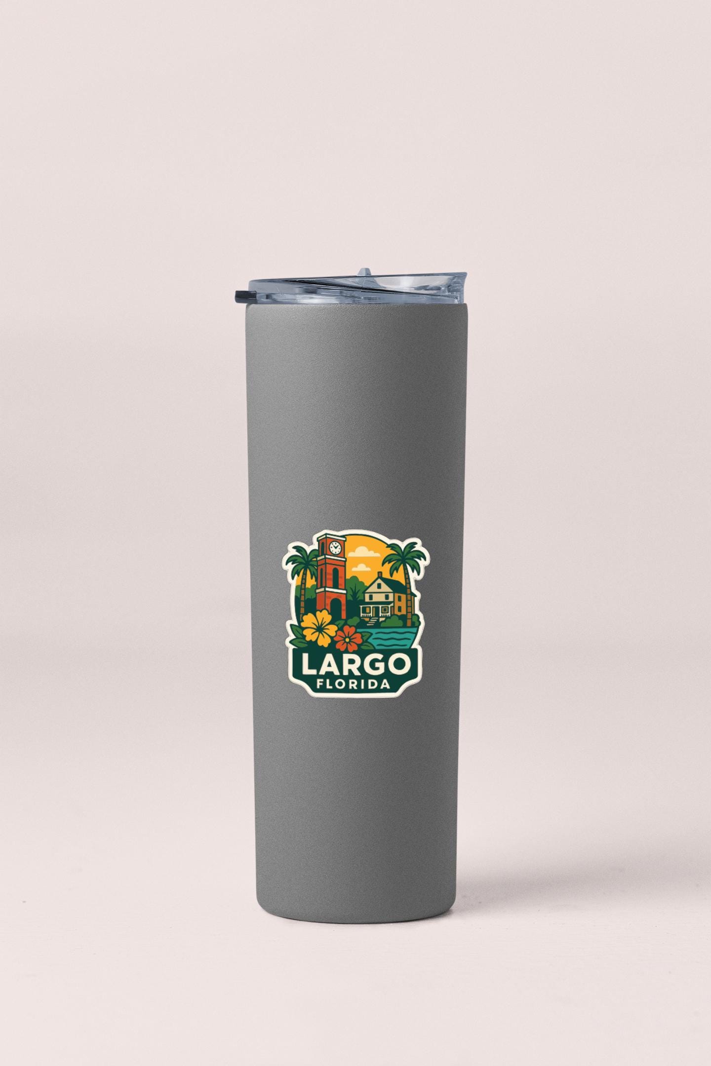 A gray insulated tumbler with a printed sticker depicting a tropical scene and the text "LARGO FLORIDA".