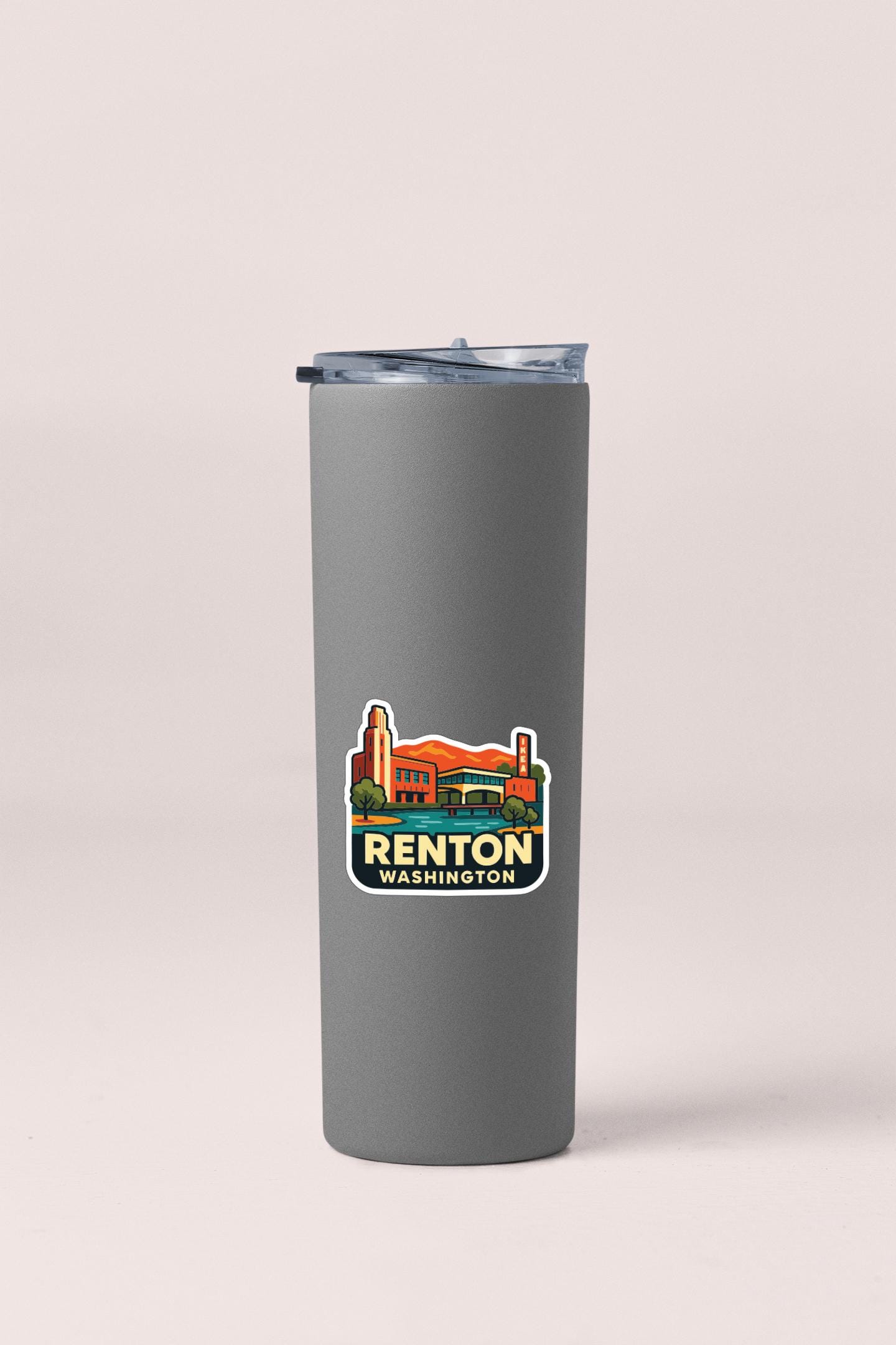 A gray insulated tumbler with a sticker depicting a building and the text "RENTON WASHINGTON".
