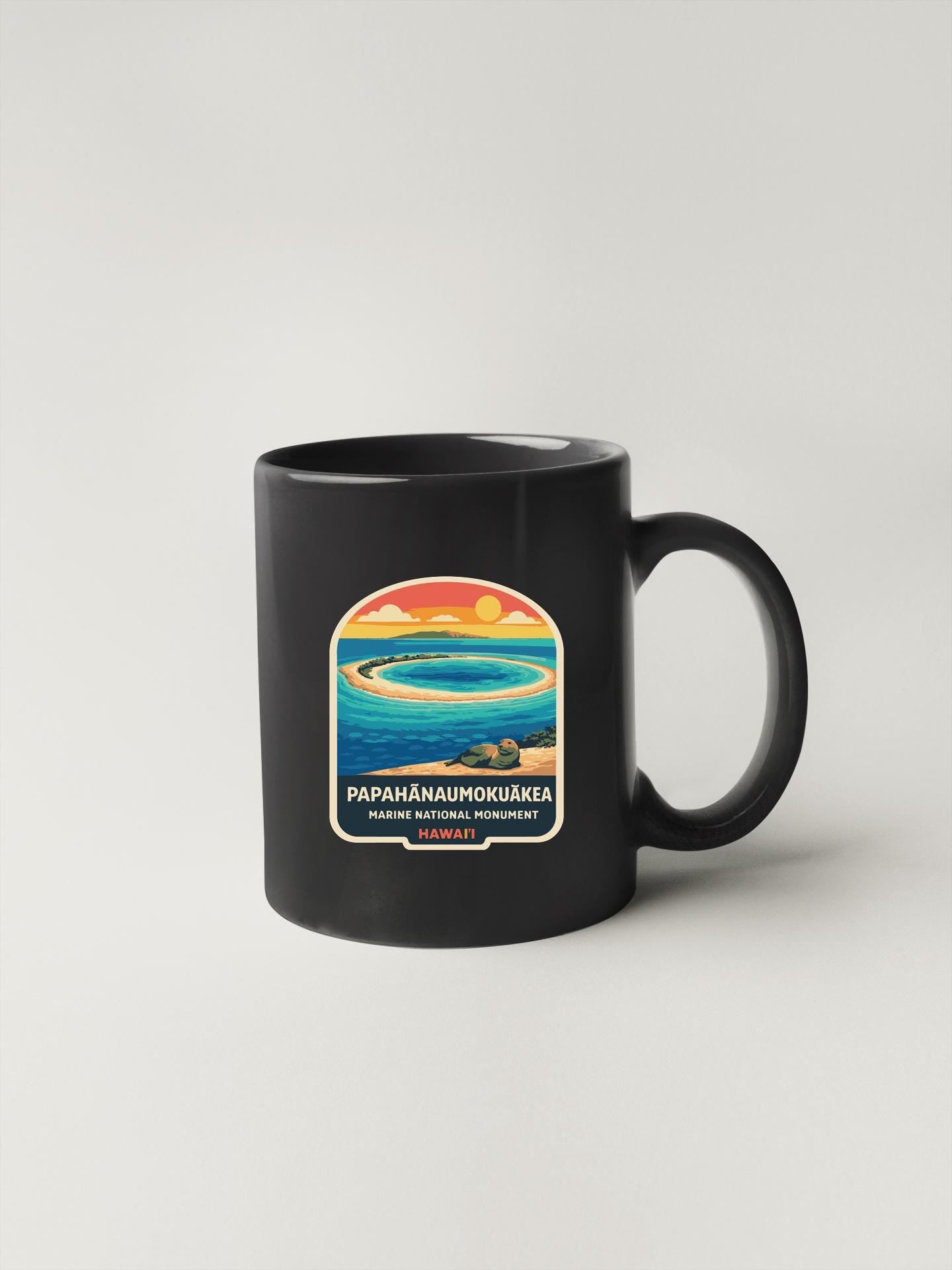 A black coffee mug with a colorful graphic design depicting a tropical beach scene.