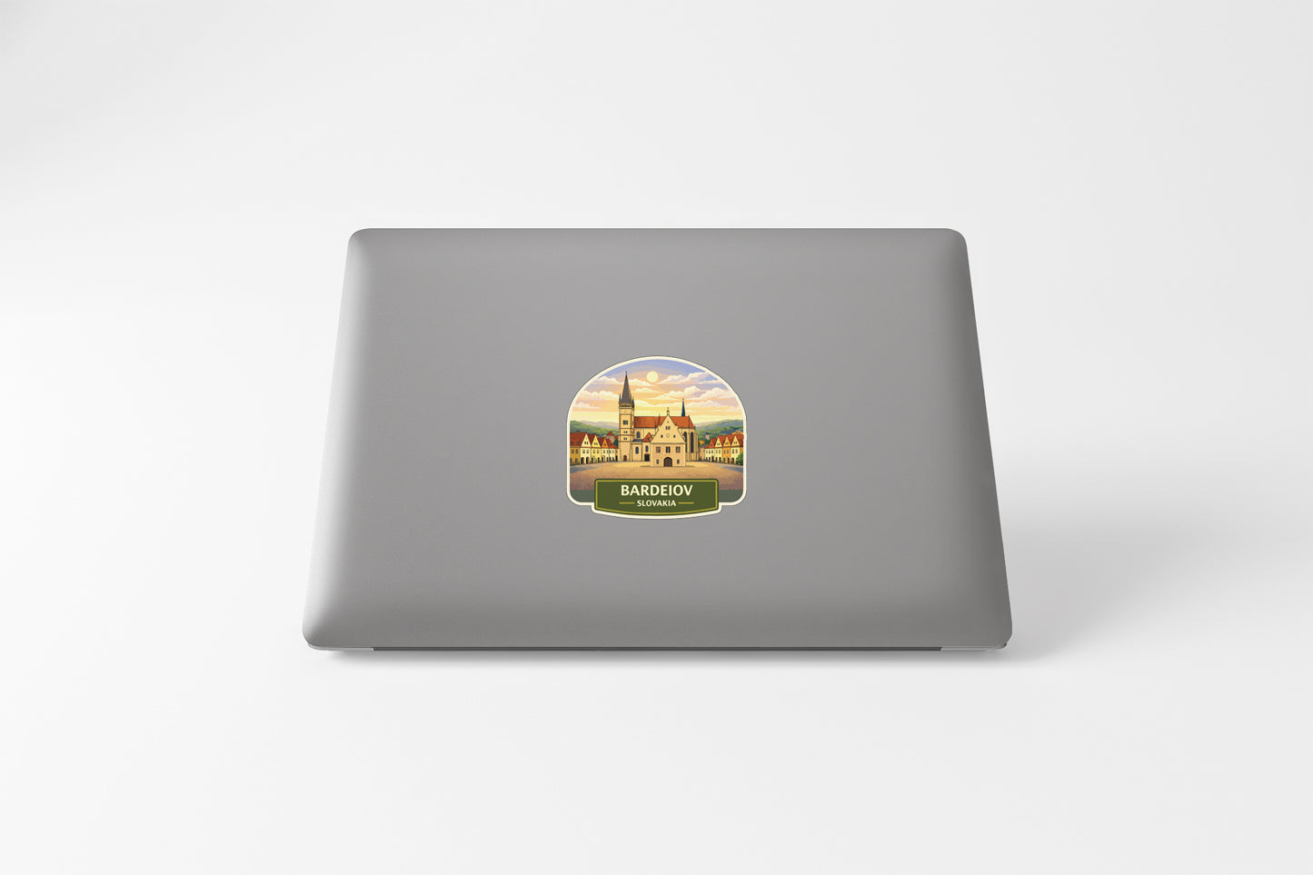 a sticker of a castle on a laptop.