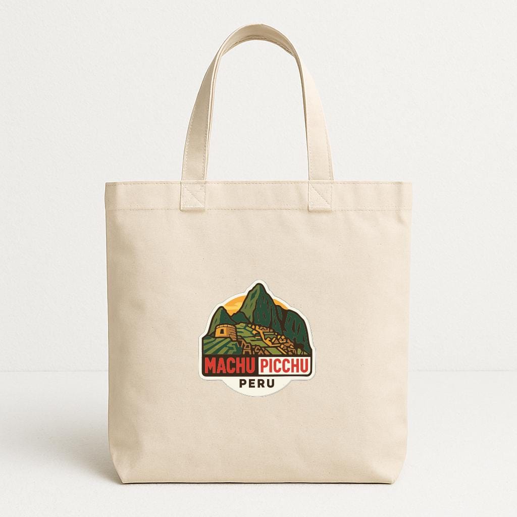 A beige tote bag with a graphic of Machu Picchu and the text "MACHU PICCHU PERU" printed on it.