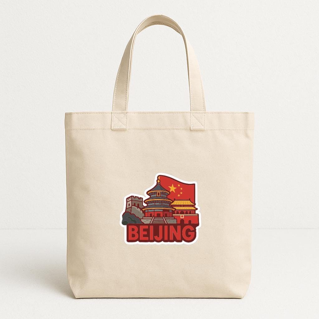 A beige tote bag with a graphic of the Forbidden City and the Chinese flag printed on it, representing the city of Beijing.