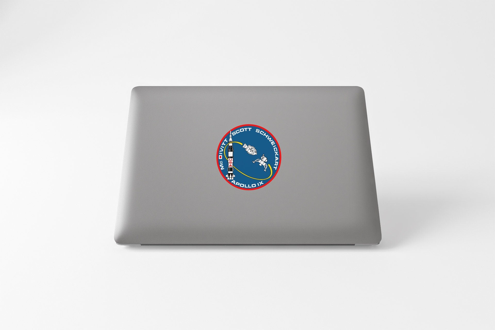 a laptop computer with a nasa sticker on it