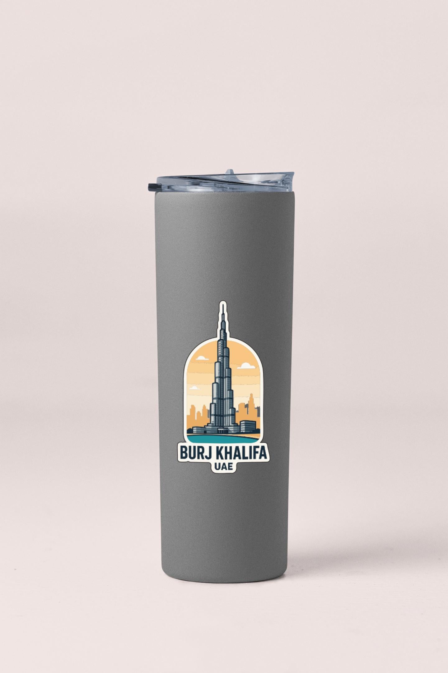 A gray tumbler with a sticker depicting the Burj Khalifa, the tallest building in the world, and the text "BURJ KHAALifa UAE" printed on it.