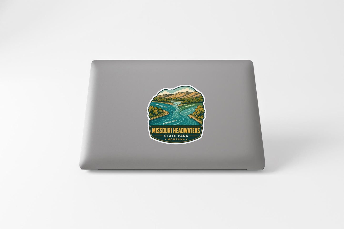 A sticker depicting a scenic landscape with a river and mountains, featuring the text "MISSOURI HEADWATERSTORES STATE PARK".