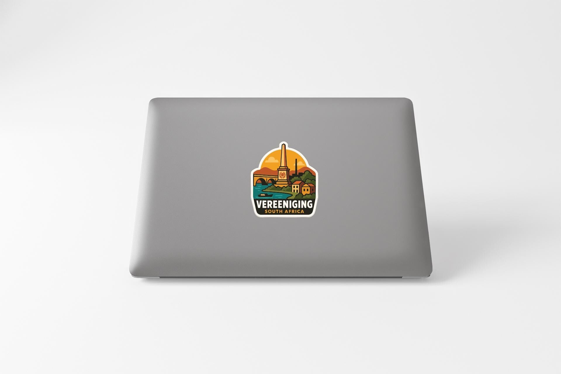 a sticker on the back of a laptop that says "VEREENING SOUTH AFRICA".