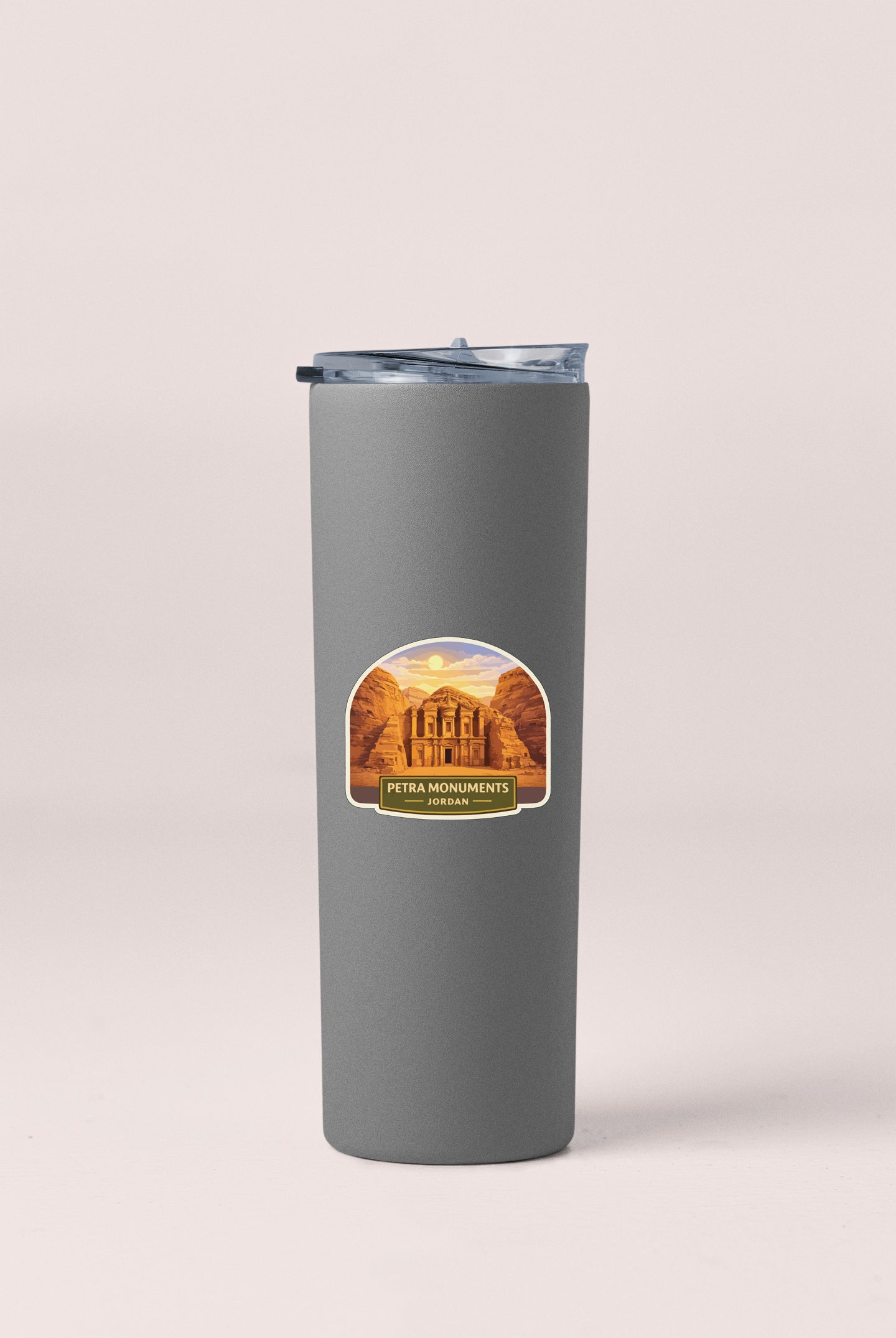 A gray tumbler with a label that says "PETRA MONUMENTS JORDAN" on it.