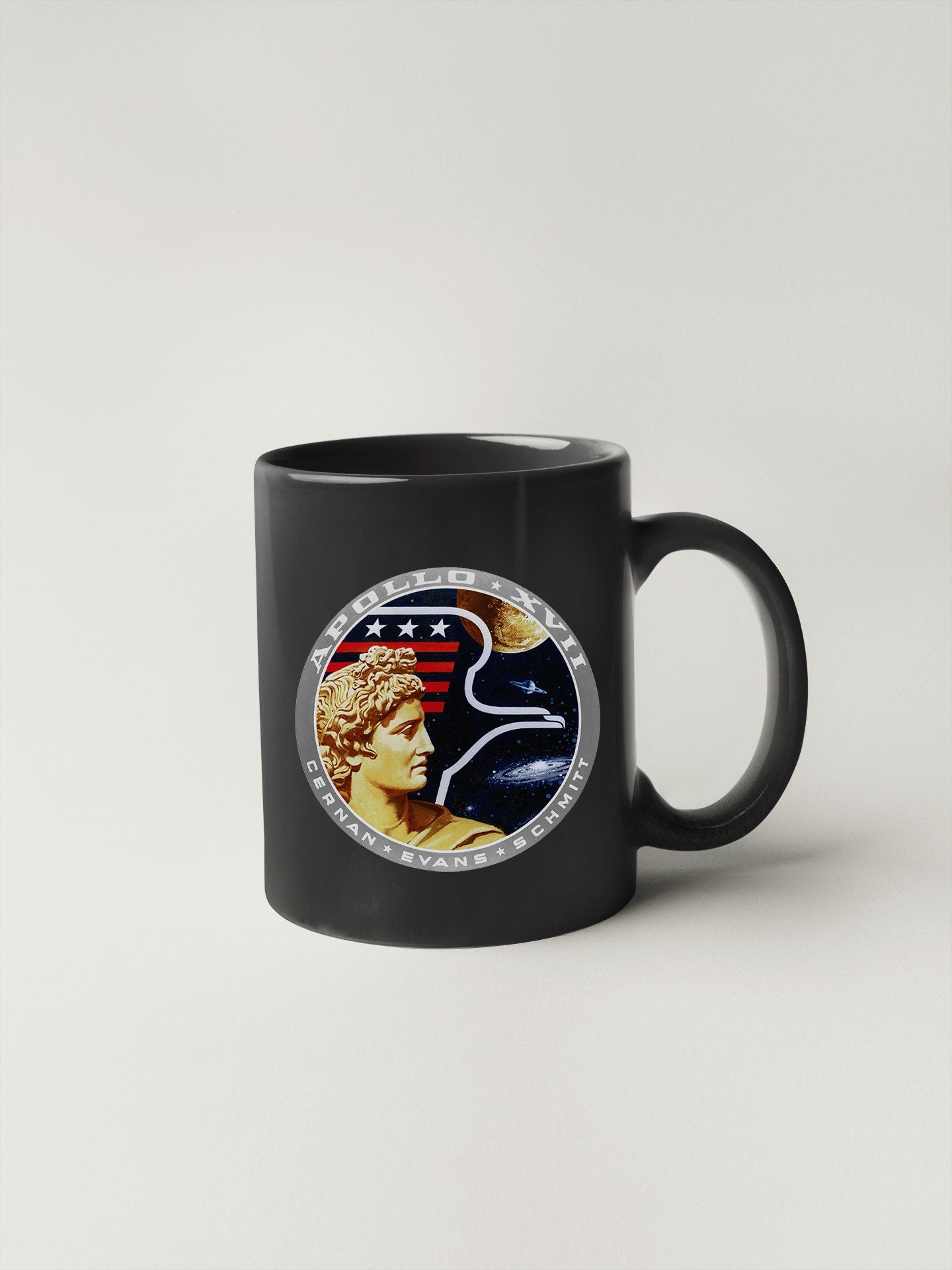 a black coffee mug with a picture of a woman's face