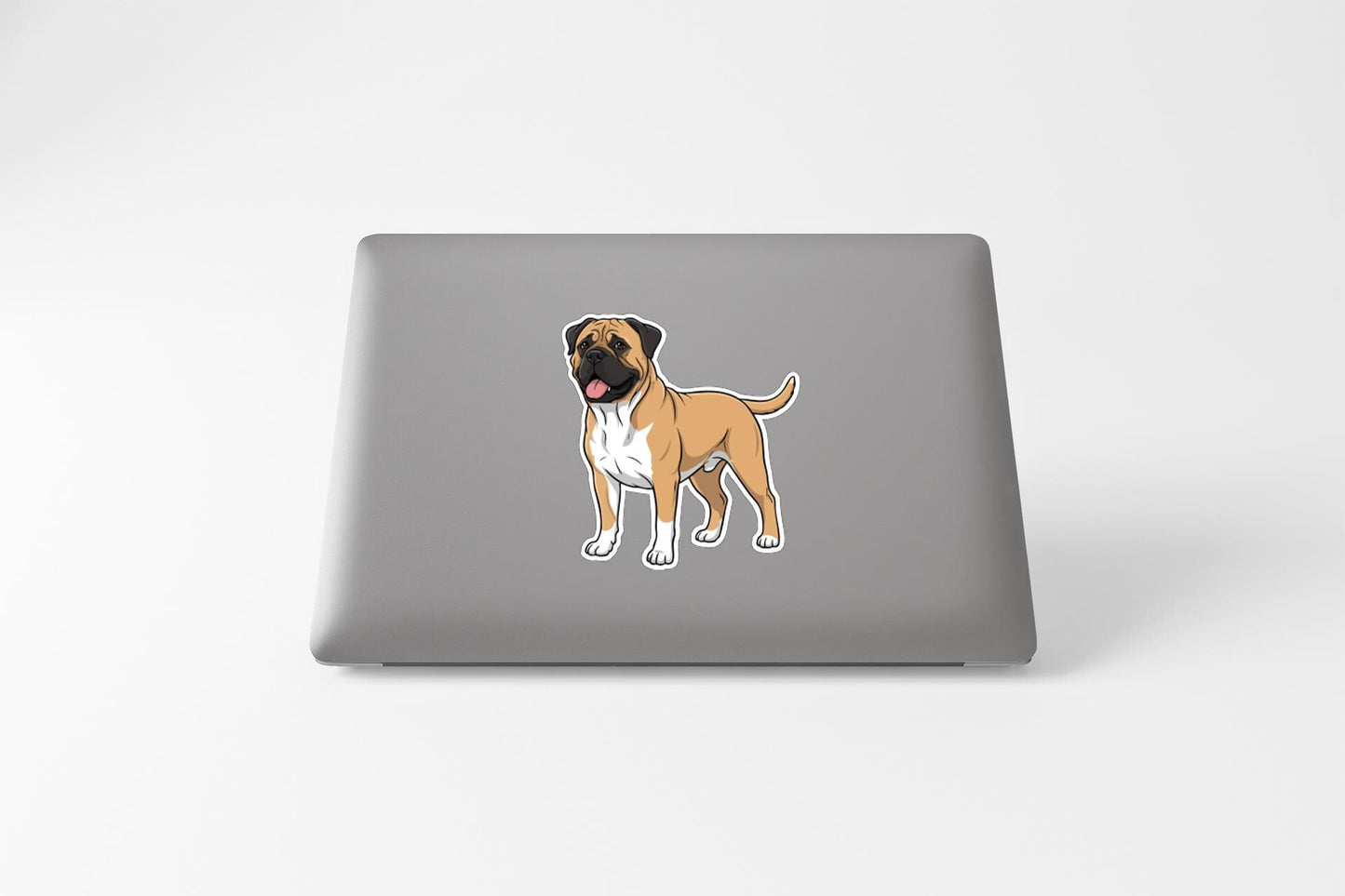 A sticker of a dog on the back of a laptop computer.