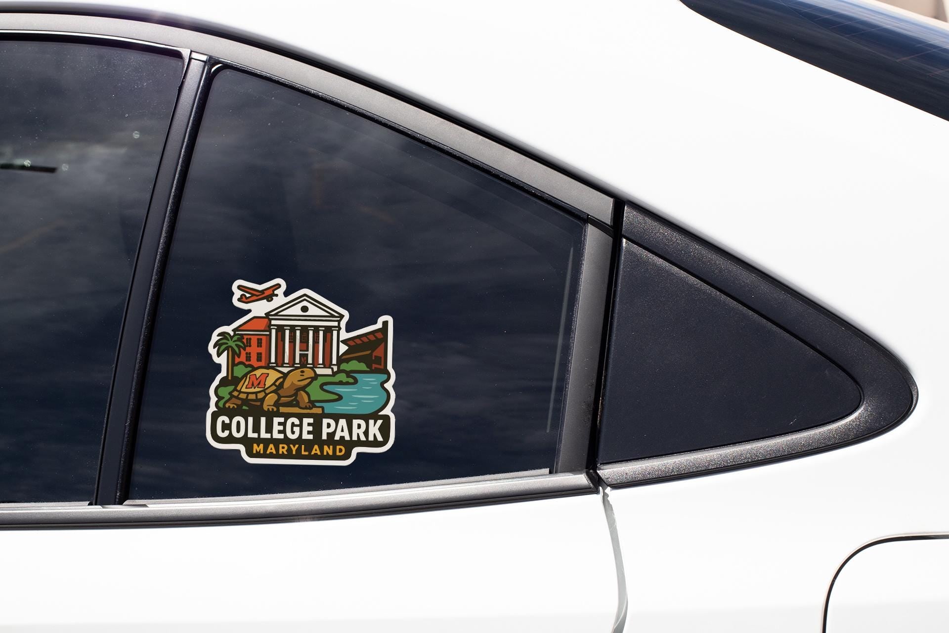 A sticker on the side of a car window, depicting a college park in Maryland.