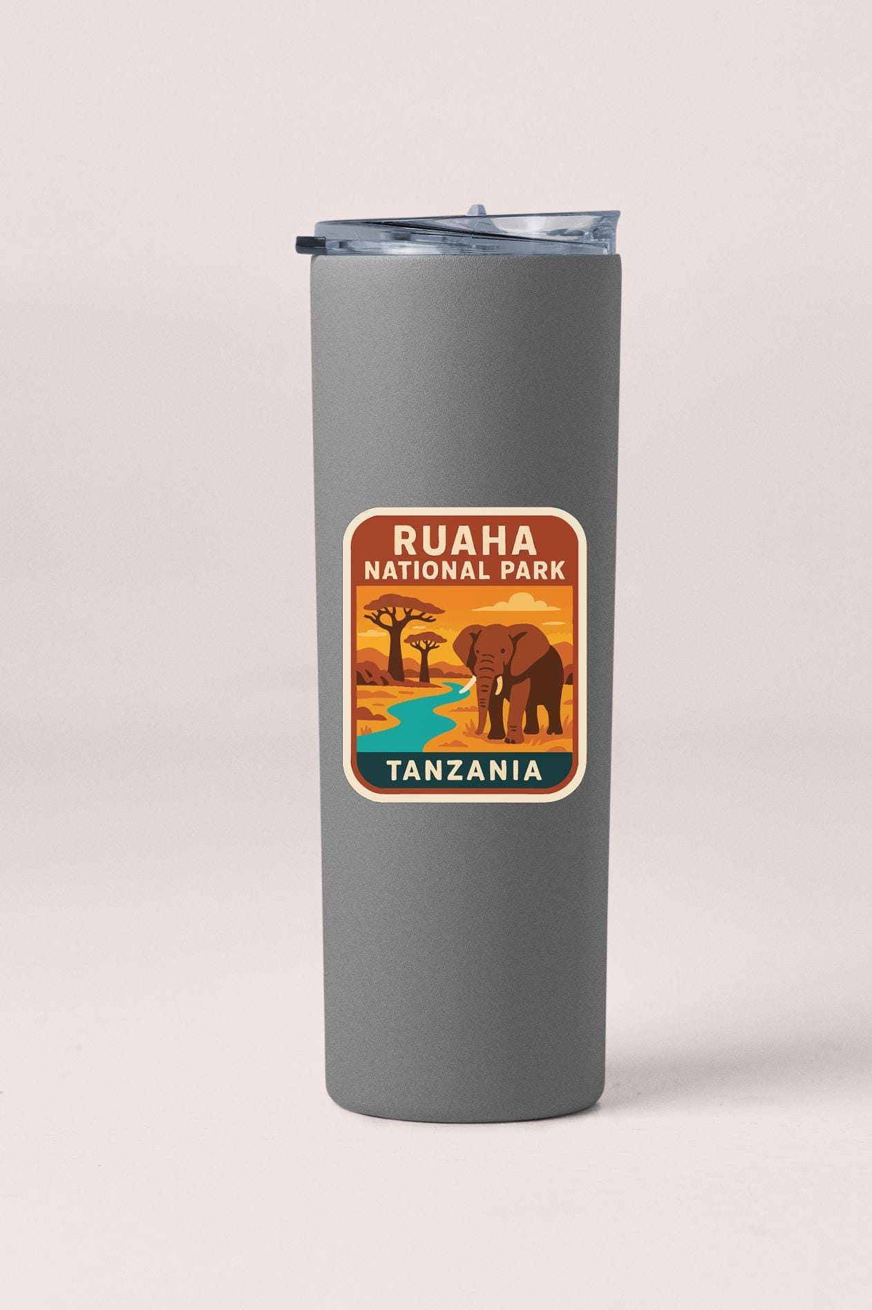 A gray tumbler with a label that says "RUAHANNA NATIONAL PARK TANZANIA".