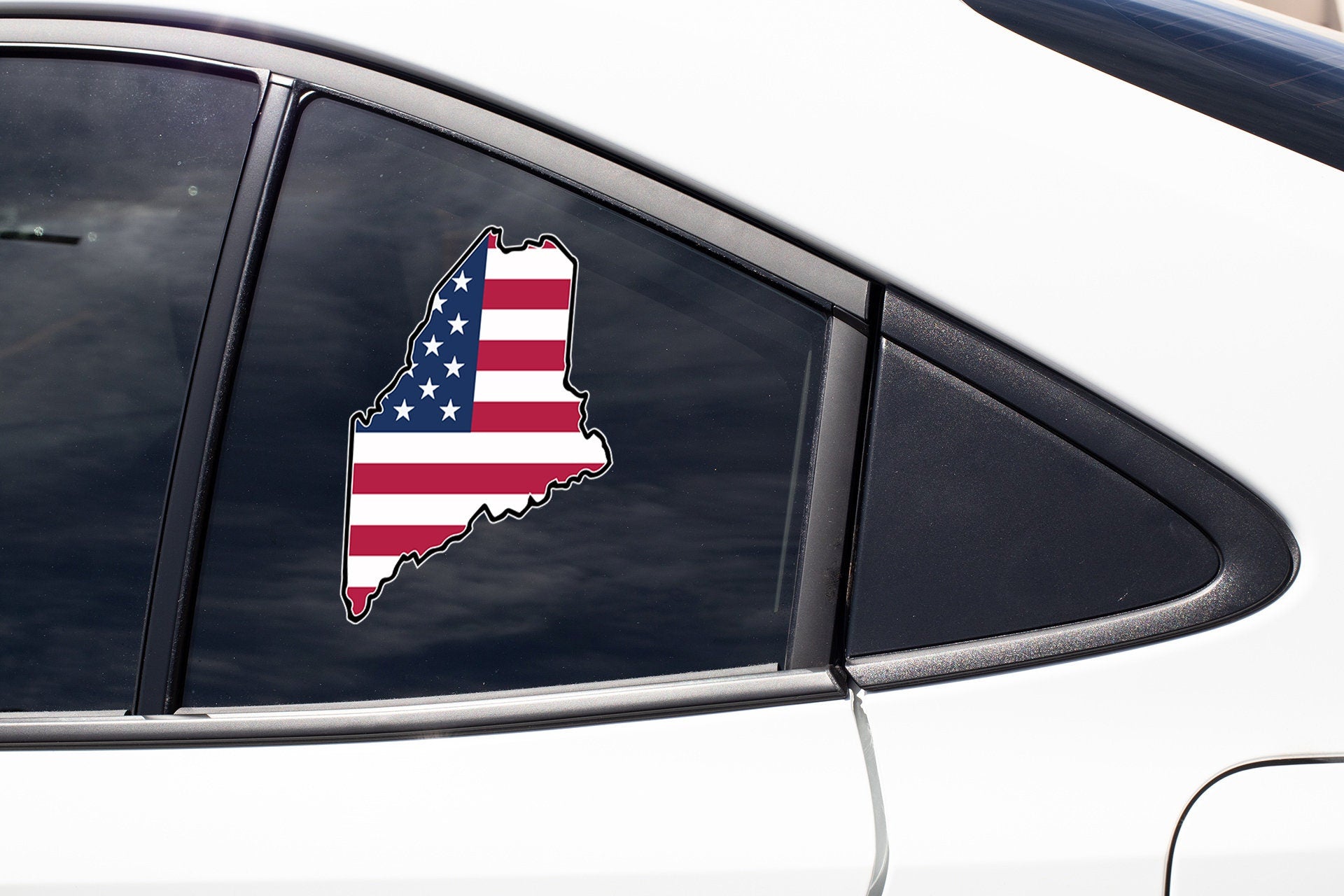 a car with a sticker of the state of texas on it