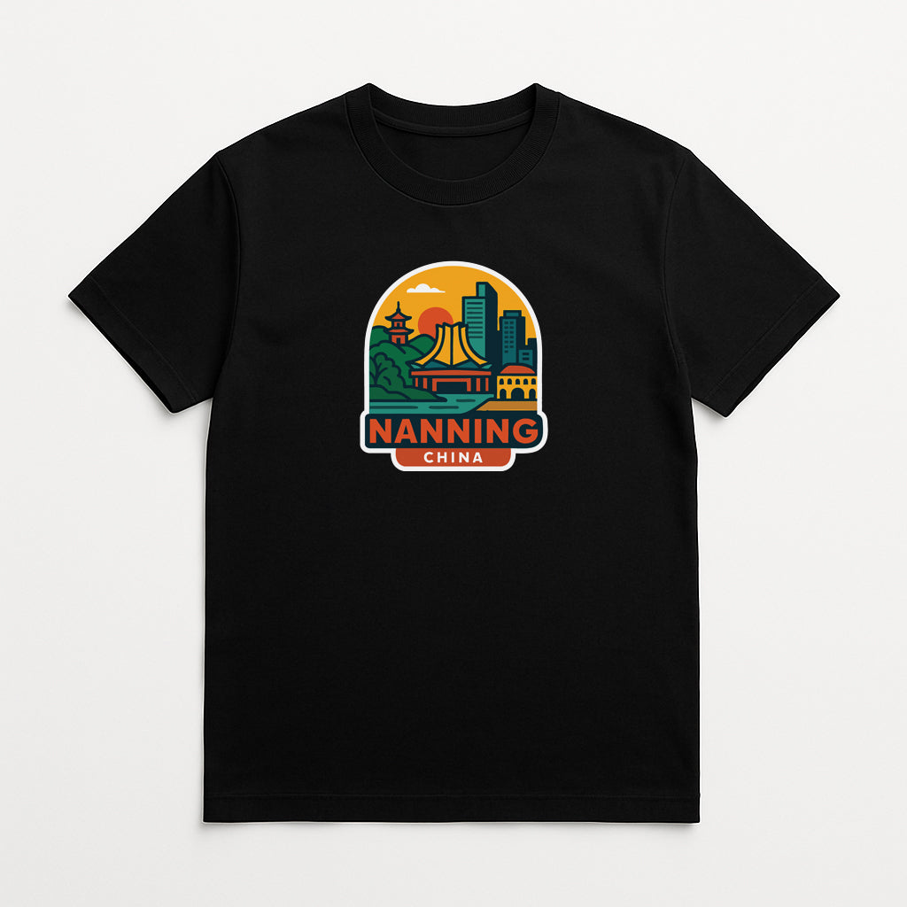A black t-shirt with a graphic design depicting a city skyline and a temple, along with the text "NANNING CHINA".