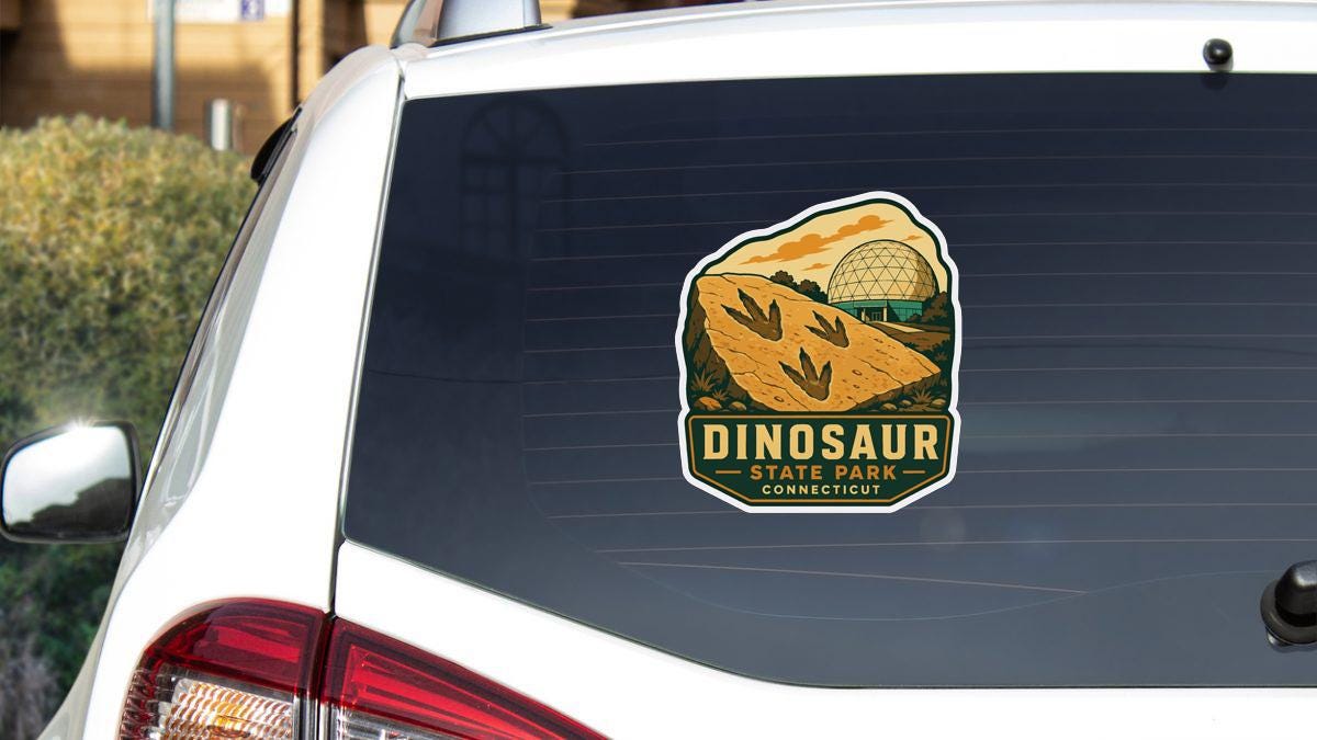 A sticker on the rear window of a white car, depicting a scenic landscape with a dinosaur and a dome, representing Dinosaur State Park in Connecticut.