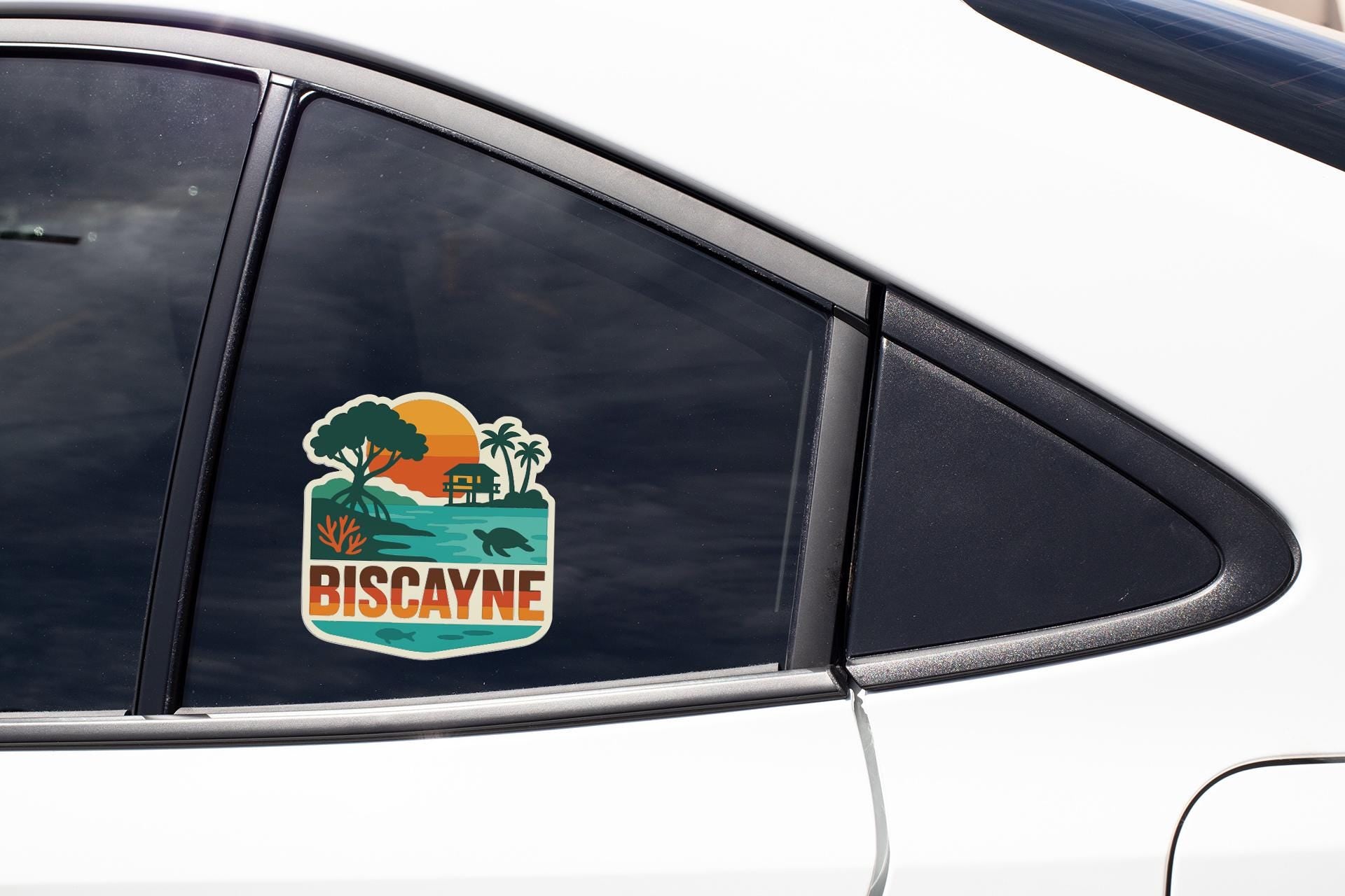 A sticker on the side of a car window that says "BISCAYNE".