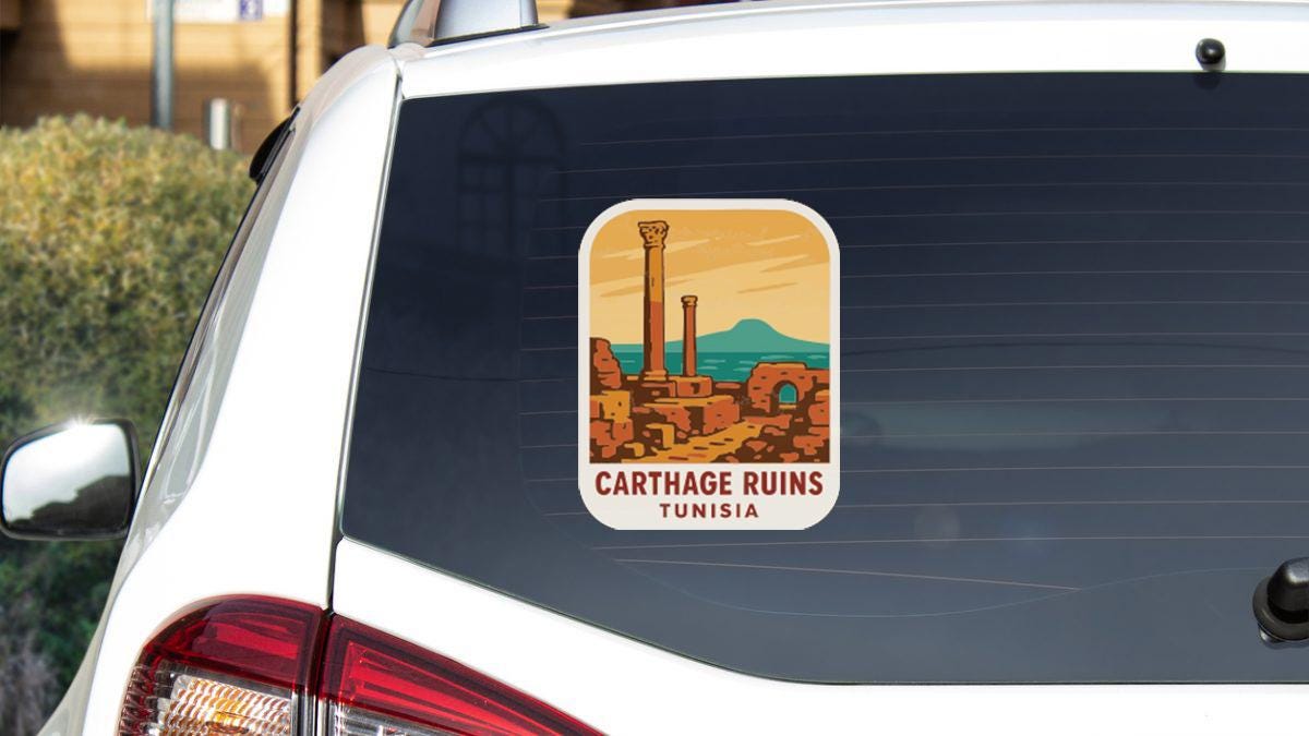 A sticker on the rear window of a car, depicting the ruins of Carthage in Tunisia.