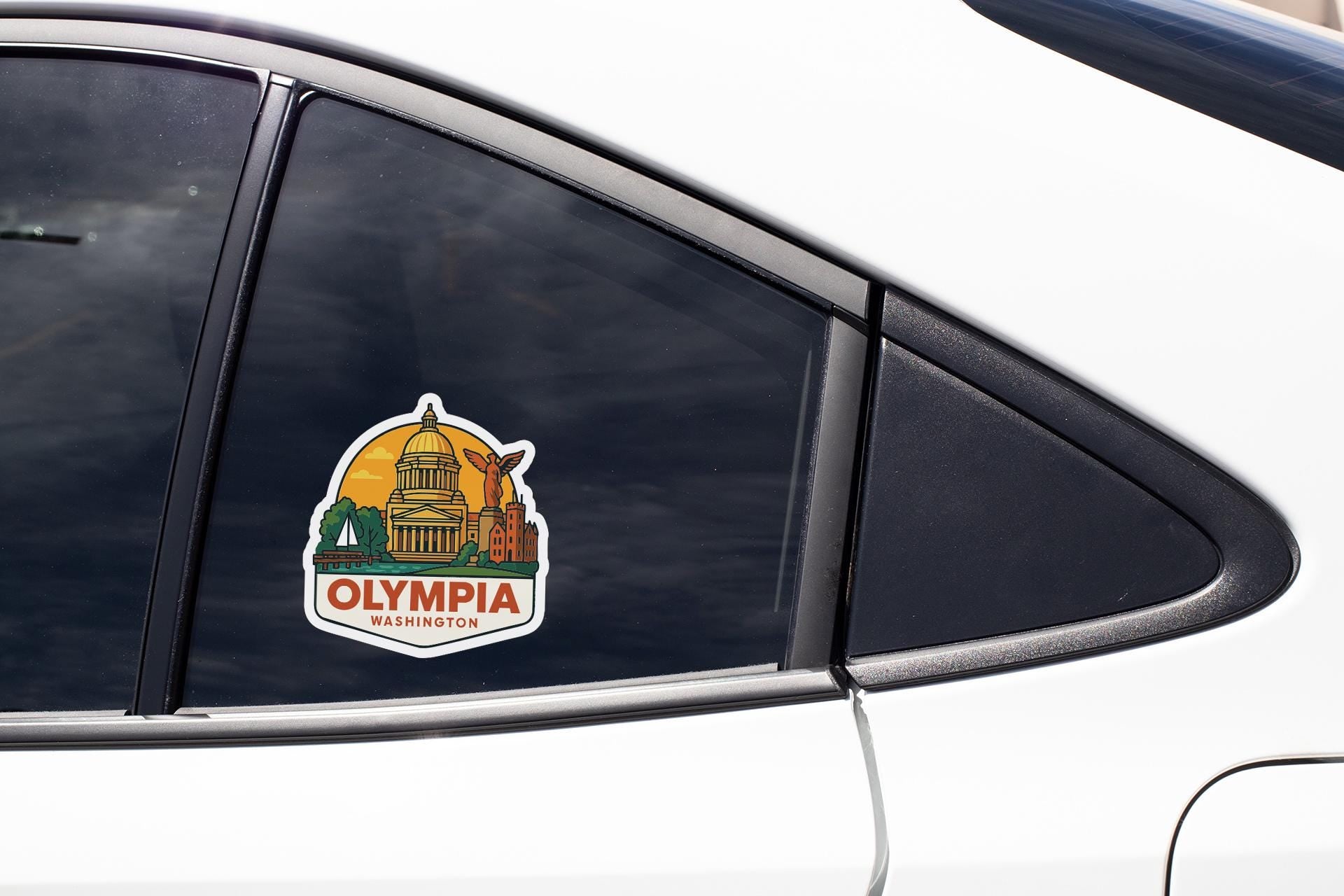 A sticker on the side of a car window that says "OLYMPIA WASHINGTON".