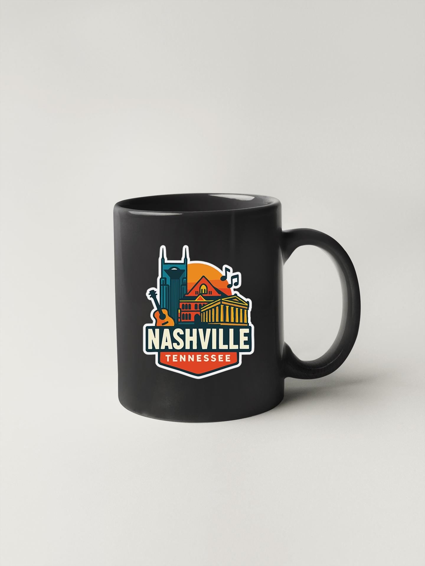 a black coffee mug with nashville on it