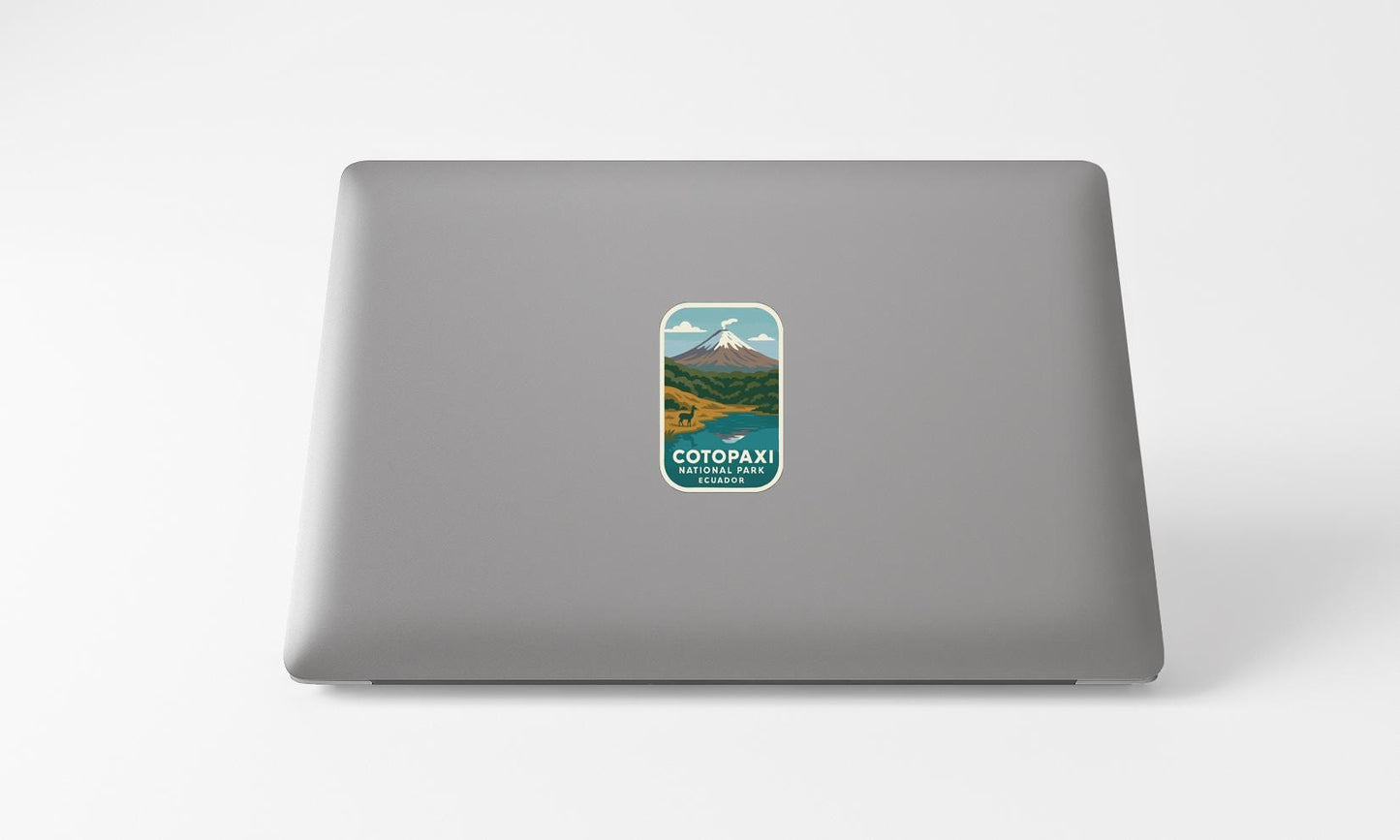 A sticker on the back of a laptop, depicting a scenic mountain landscape with a mountain peak and a lake.