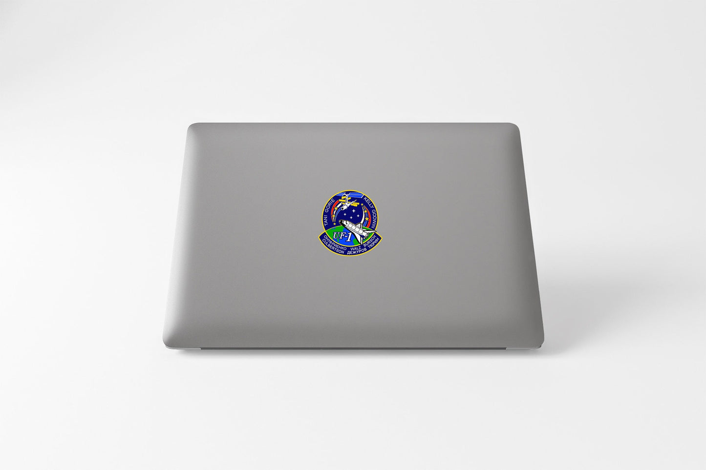 a laptop with a sticker of a bird on it