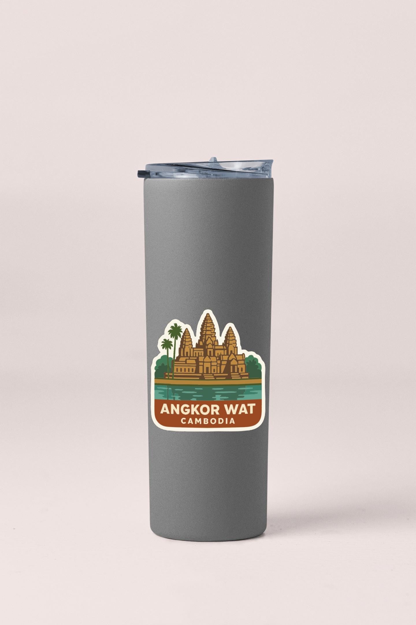 A gray tumbler with a sticker depicting the Angkor Wat temple complex in Cambodia.