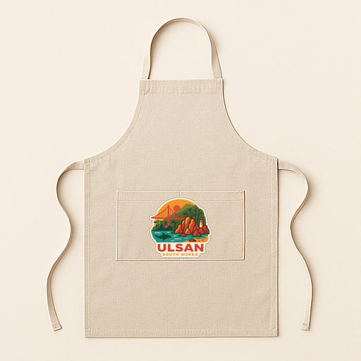 A beige apricot with a graphic design depicting a scenic landscape, including mountains, a bridge, and a body of water.
