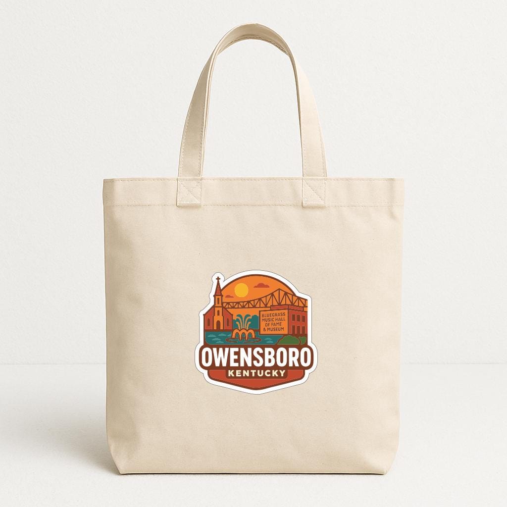 A beige tote bag with a printed logo that says "Owensboro, Kentucky".