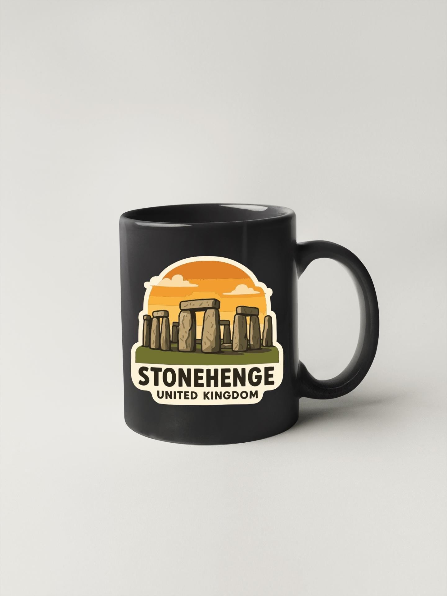 A black coffee mug with a graphic design depicting Stonehenge, a famous monument in the United Kingdom.