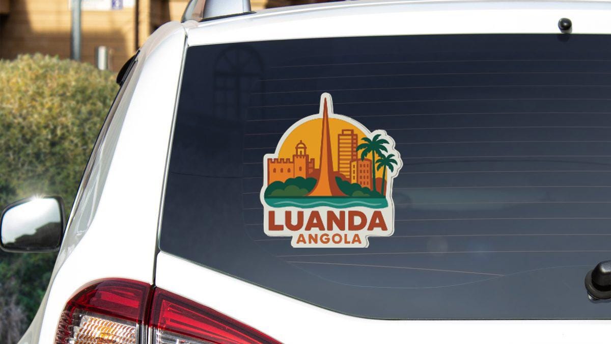 a sticker on the rear window of a car that says "LUANDA ANGOLA".