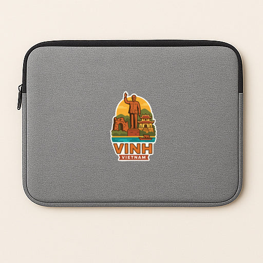 a gray laptop sleeve with a sticker depicting a statue of a man, surrounded by various landmarks and buildings, representing the city of Vih.
