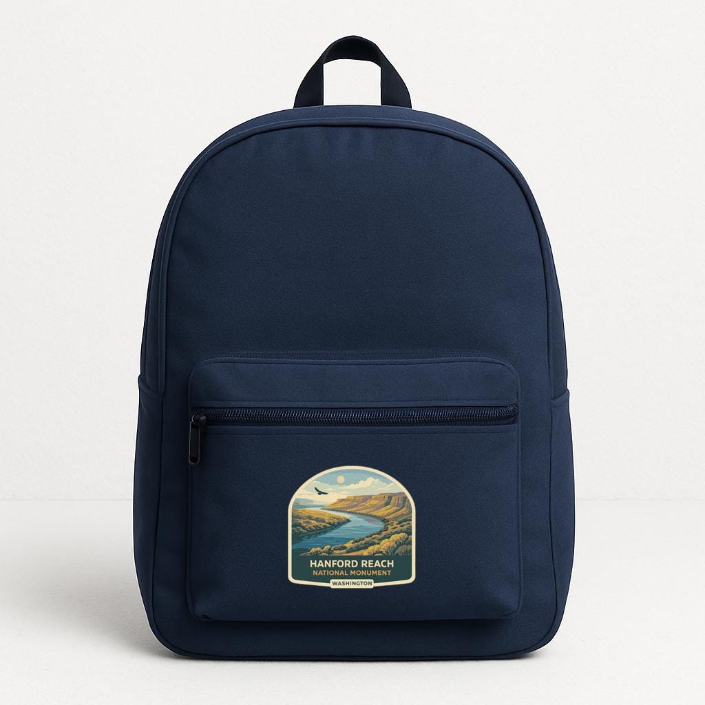 A navy blue backpack with a label that says "HANFORD BEACH WASHING VANCOUVER" on the front pocket.
