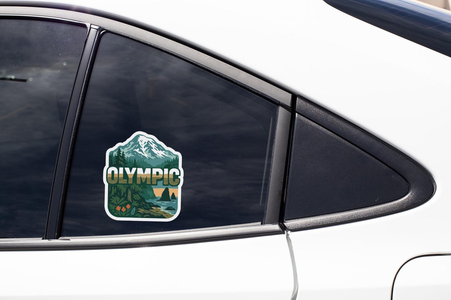 A sticker on the side of a car window that says "OLYMPIC".