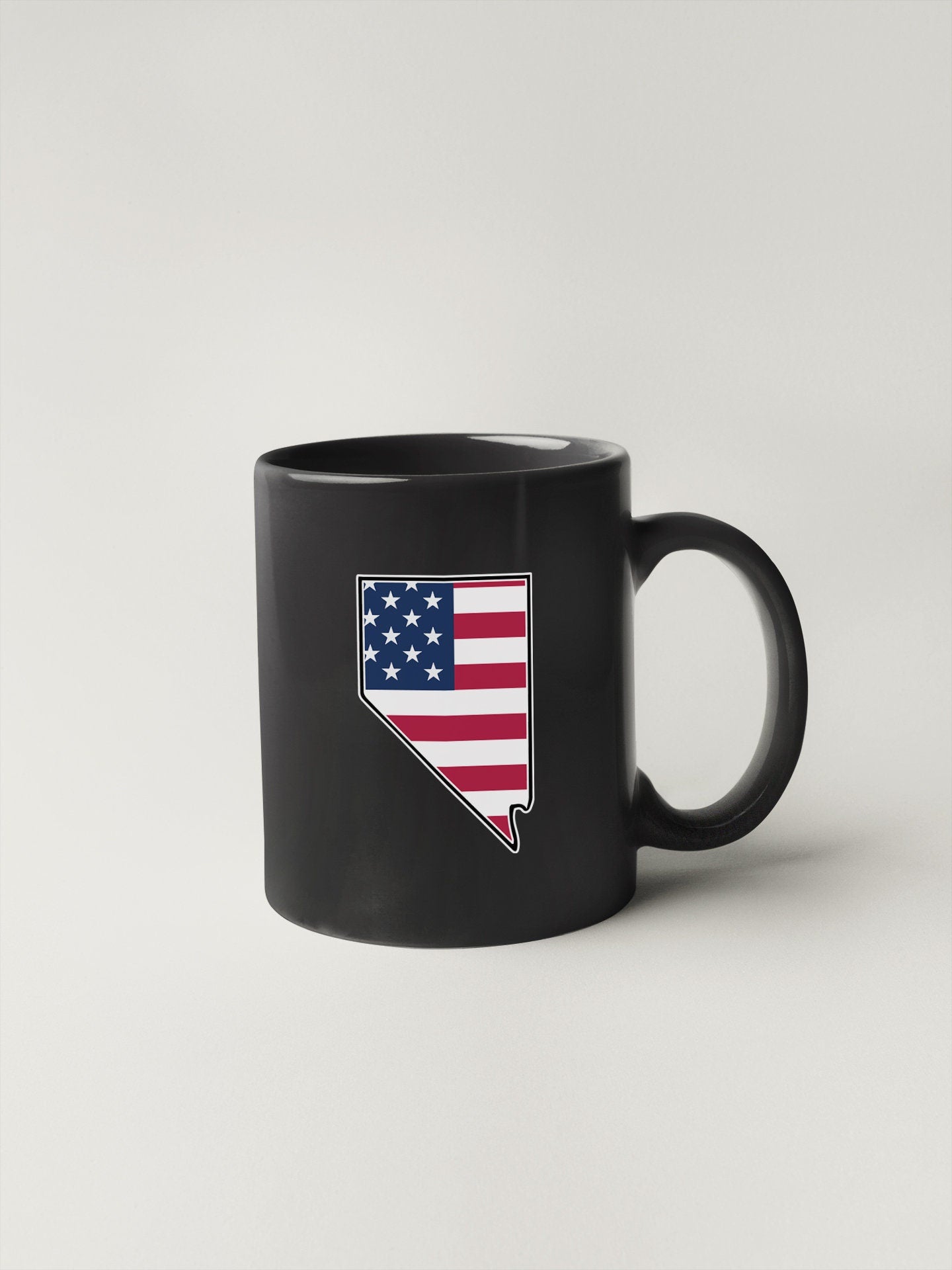 a black coffee mug with the state of arizona on it