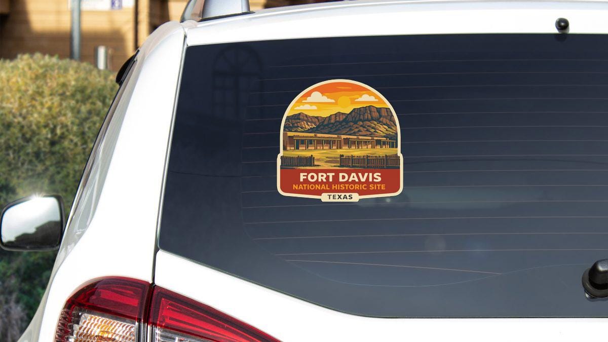 A sticker on the rear window of a car that says "Fort Davis National Historic Site" and "TEXAS".