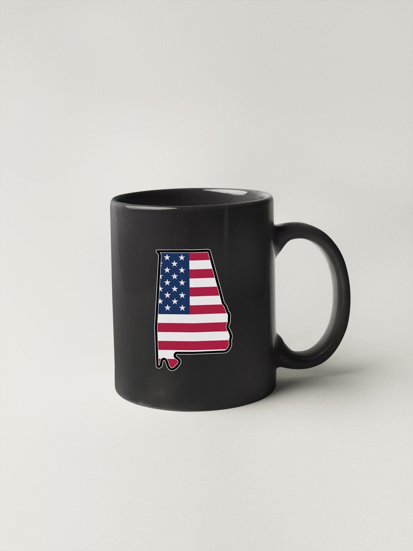 a black mug with the state of arizona painted on it