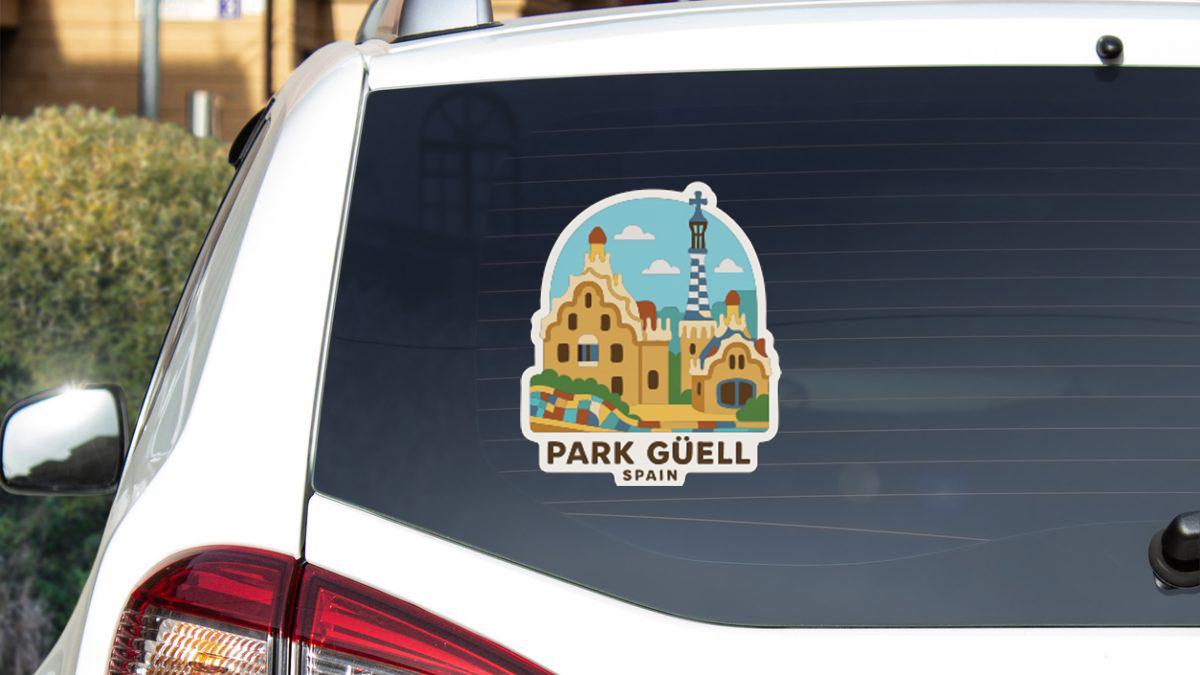 A sticker on the rear window of a car, depicting the Park Güell in Spain.