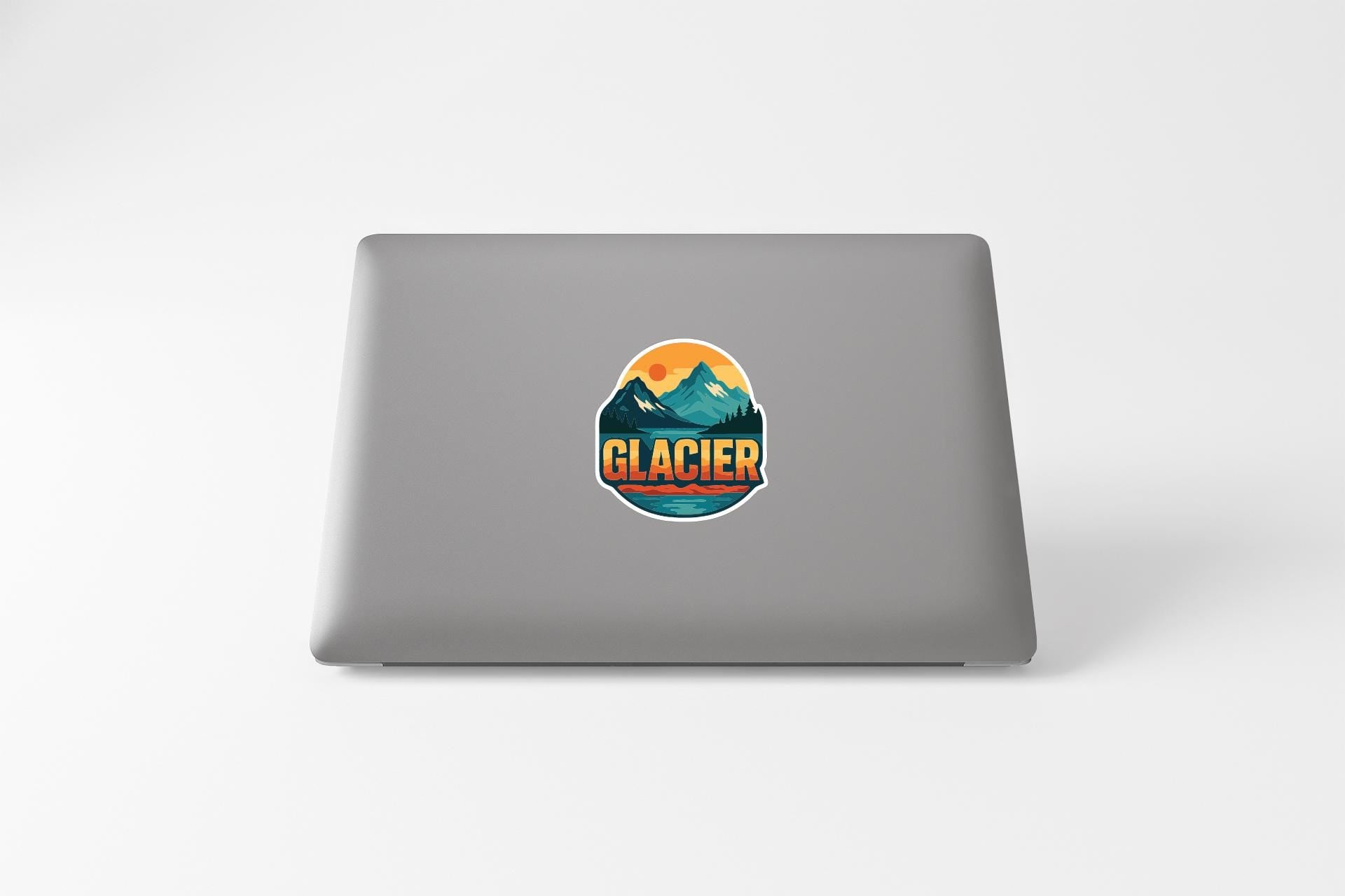 A sticker with the word "GLACIER" on a laptop.