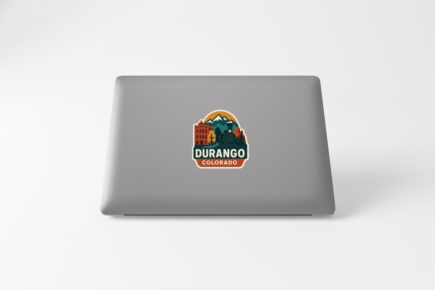 a sticker with a mountain and buildings, along with the text "DURANGO COLORADO".