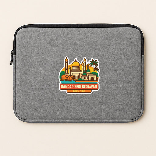 a gray laptop sleeve with a sticker depicting a cityscape and the text "BANDAR SERI BEGAWAN".