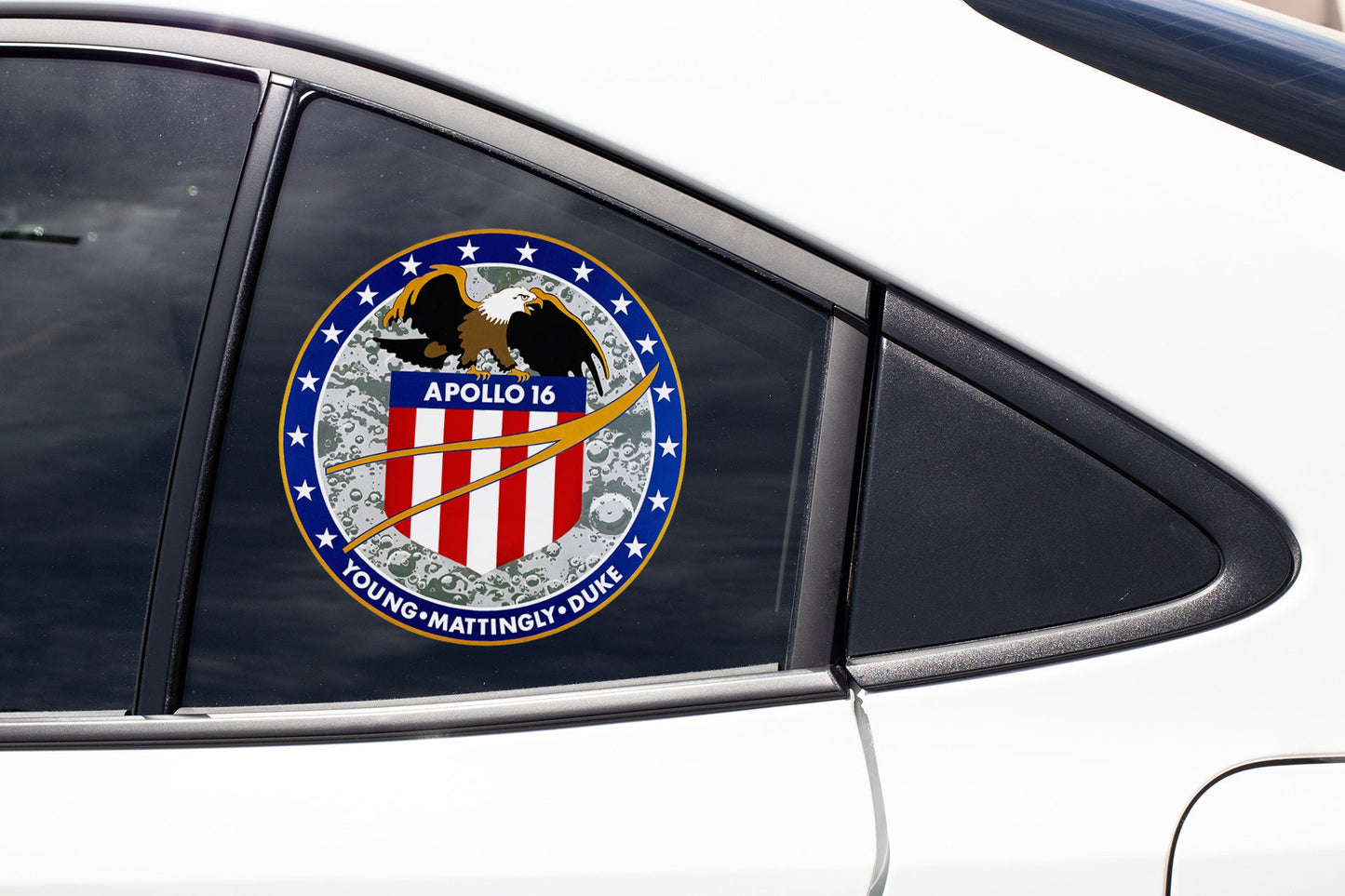 a sticker on the side of a white car