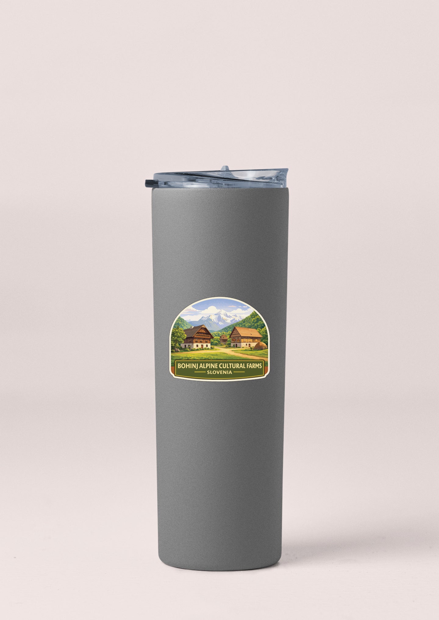 A gray insulated tumbler with a label that says "Bohine Alpine Cultural Farm Slovakia".