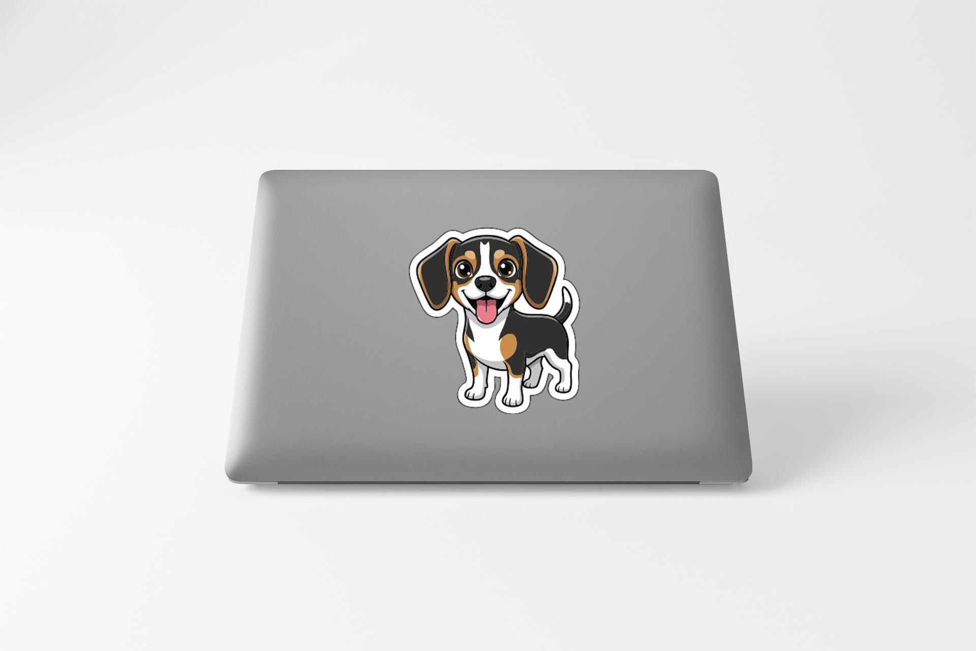 A sticker of a cartoon dog on the back of a laptop computer.