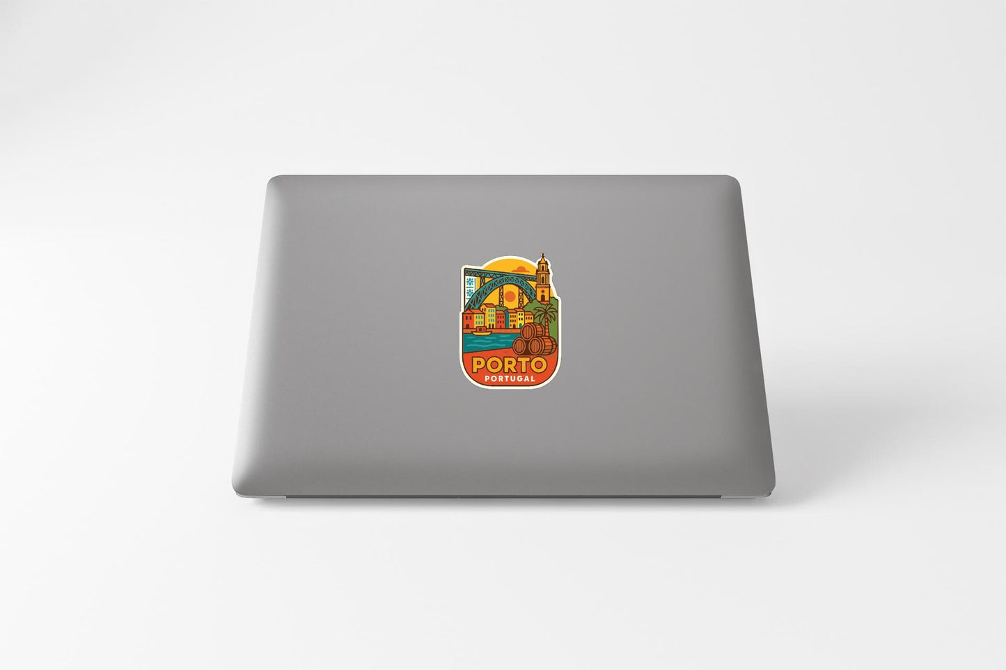 a sticker with a colorful illustration of a cityscape, specifically Porto, Portugal.